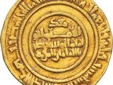 a close up of a gold coin on a white background