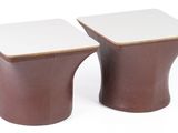 pair of brown and white ceramic stools on a white background