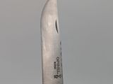 a knife that is sitting on top of a knife holder