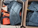 a cardboard box filled with blue jeans and a pair of orange shoes
