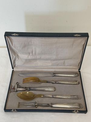 a silverware set in a case with a spoon and fork