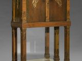 an old wooden cabinet with a mirror on top of it