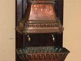 a wooden shelf with three bowls on top of it