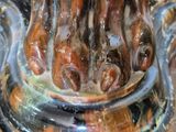 a close up of a glass vase with a design on it