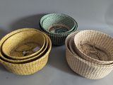 three woven baskets sitting on top of a table next to each other