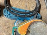 a lot of wires and a hose on the floor