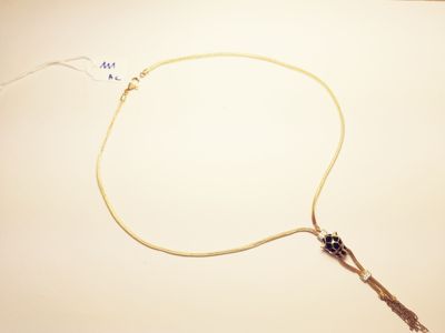a necklace that has a long cord attached to it