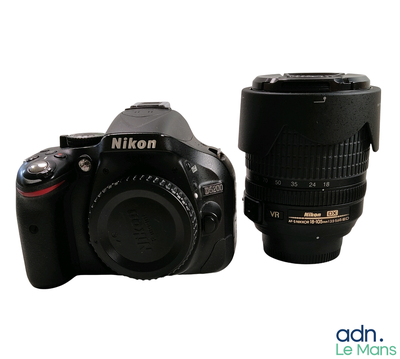 a black camera and a black lens sitting next to each other