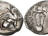 a silver coin with an image of a man holding a sword