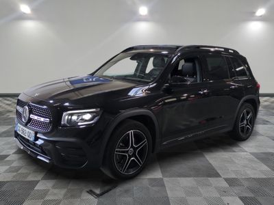 the mercedes gls is parked on a checkered floor