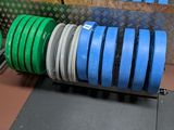 a lot of green and blue plates on the floor