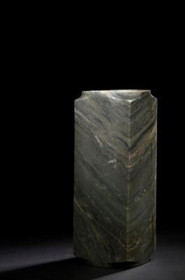 an image of a green marble pedestal on a black background