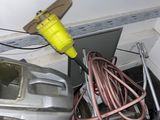 a pile of junk in a room with a vacuum and other items