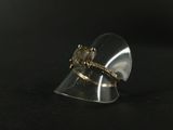 an image of a gold ring with a diamond on it