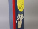 an open book with a picture of a person in a hot air balloon