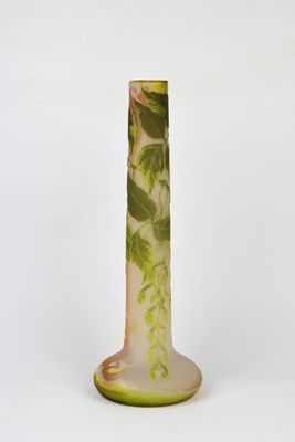 an image of a tall vase with a green and white design on it