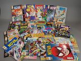 a pile of comic books sitting on top of a table