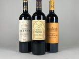 trois bouteilles de vin sont alignées sur une table