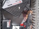 a box with a drill and other tools inside of it