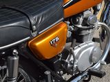 a close up of a motorcycle parked on the street
