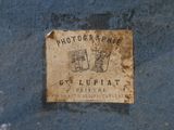 a sign on the side of a building that says photographer