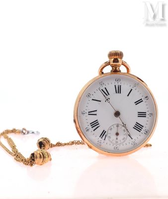 a gold pocket watch with roman numerals on it