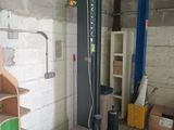a machine that is sitting in a room with boxes