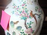 a vase that has a pink tag on it