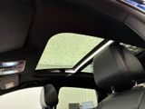 a view of the sunroof from inside of a car
