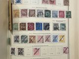 an open book with a bunch of different stamps on it