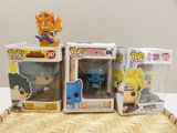 three different pop vinyl figures on a table