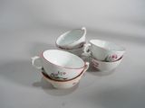 three cups and saucers are sitting on a white surface