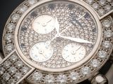 an image of a close up of a wrist watch with diamonds on it