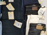 several pairs of men ' s jeans are on display in a store