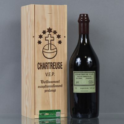 a wooden box with a bottle of wine next to it