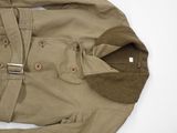 an image of a jacket with a belt is shown on a white surface