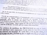 a close up of an open book with a picture of a clock on it