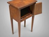 a small wooden table with a drawer on one side and a drawer on the other side