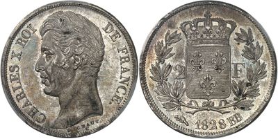 a silver coin with a crown on the front and a crown on the back