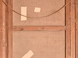 an old picture of a wooden frame with a piece of paper taped to it