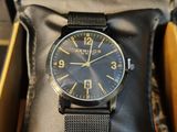 a watch that is sitting in a box on a table
