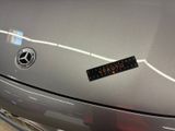 a picture of a car with a sticker on it ' s hood