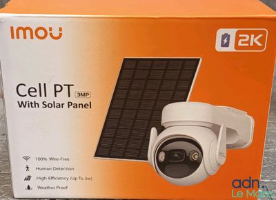 an orange box with a solar panel inside of it on a table