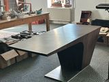 a room with a desk and a chair in it
