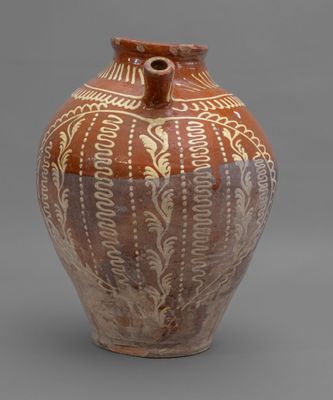 une image représentant un vase marron et blanc sur fond gris