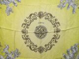 an image of a yellow table cloth with a clock on it