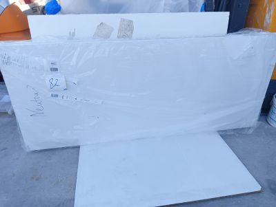 a pile of white boxes sitting on the ground
