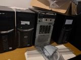 four computers that are sitting on top of a table