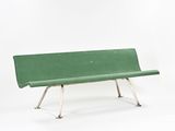 a green bench that is sitting on a white surface