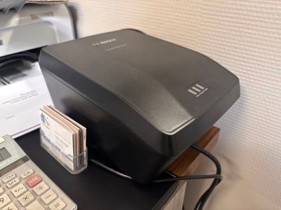 an image of a printer and a calculator on a desk